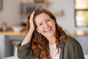 Red haired woman smiling - dentist in Swansea, IL